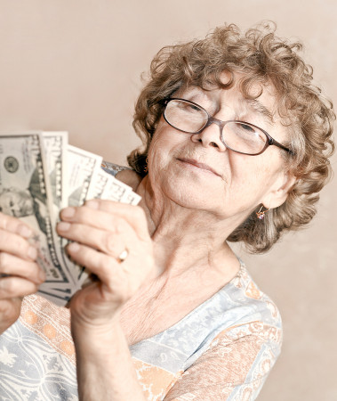 bigstock_senior_happy_woman_with_money_21419264.jpg